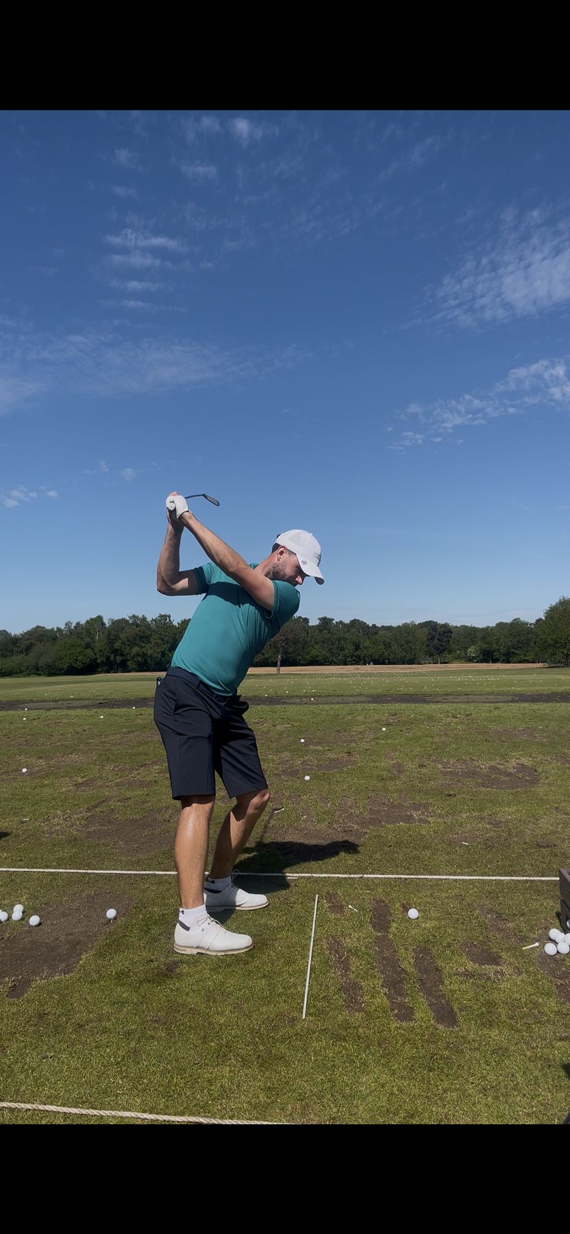 Lining up a putt in tournament play with the gallery watching