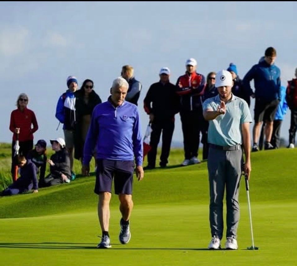 David Howard on the green with John Howard following behind
