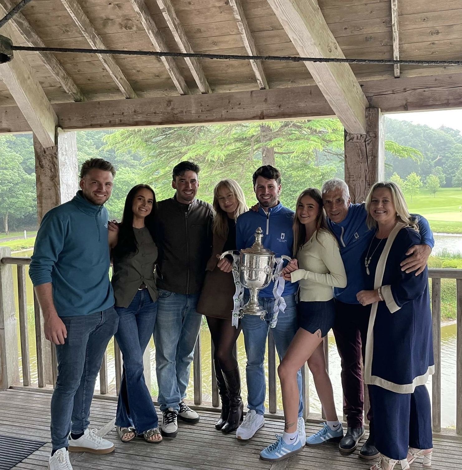 The Howard family and friends together with the trophy
